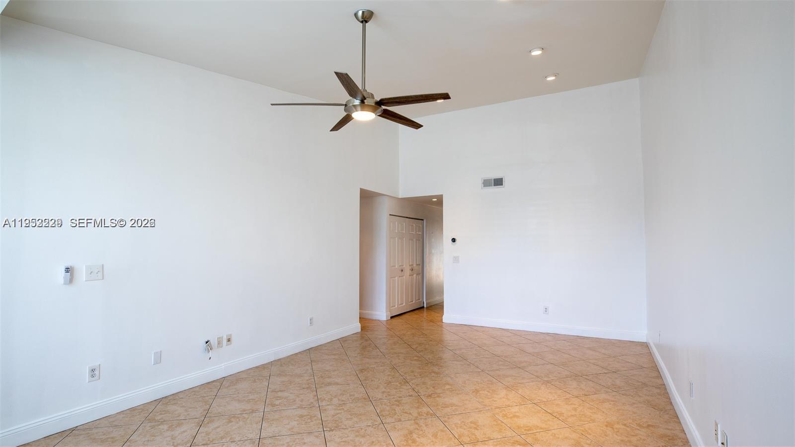 14206 Southwest 97th Terrace Miami, FL 33186 - Photo 5 of 33 a view of a room with an empty space