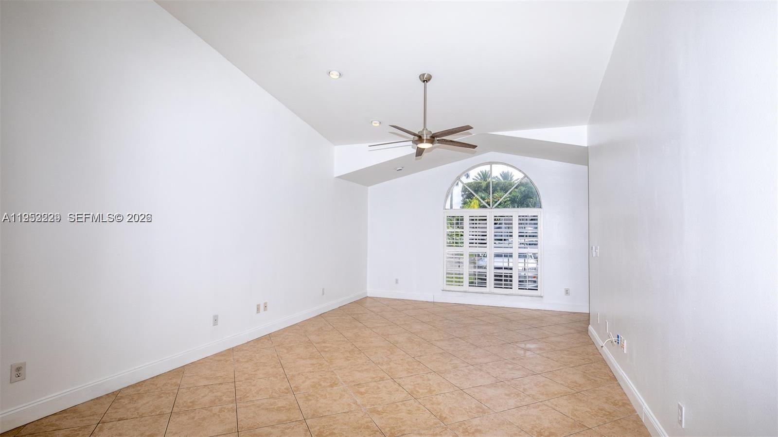 14206 Southwest 97th Terrace Miami, FL 33186 - Photo 7 of 33 a view of an empty room with a window