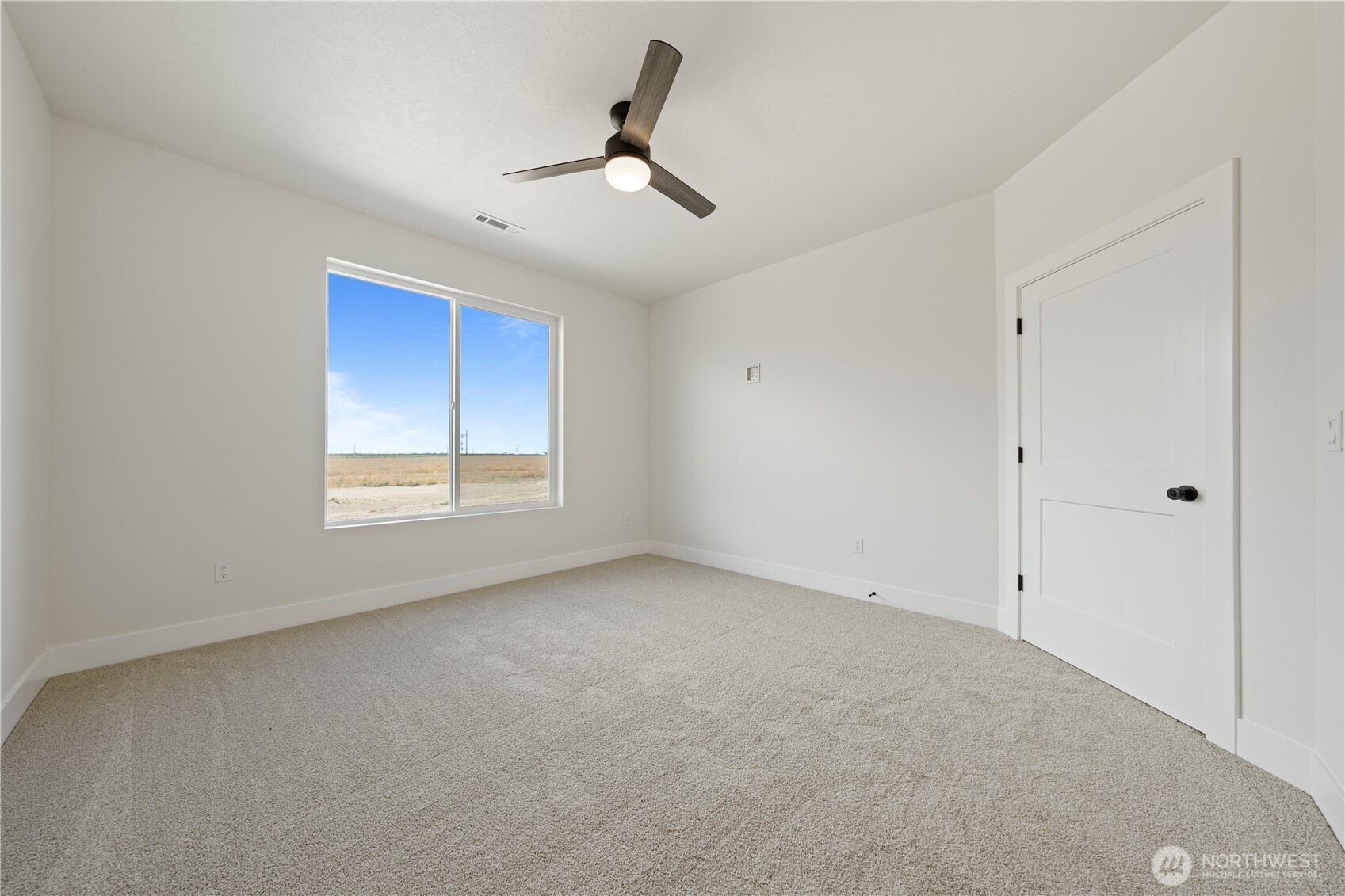 1111 E Mount Othello, WA 99344 - Photo 17 of 34 a view of an empty room with a window
