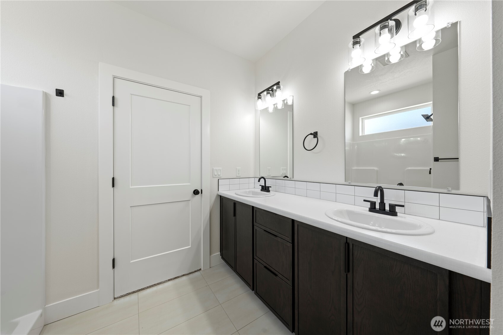 1111 E Mount Othello, WA 99344 - Photo 19 of 34 a bathroom with a double vanity sink and a mirror