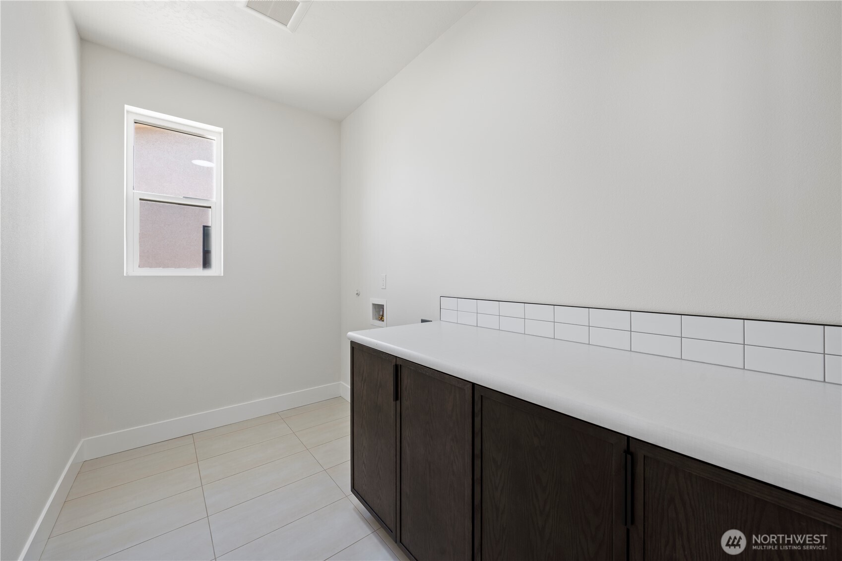 1111 E Mount Othello, WA 99344 - Photo 2 of 34 a kitchen with a sink and cabinets