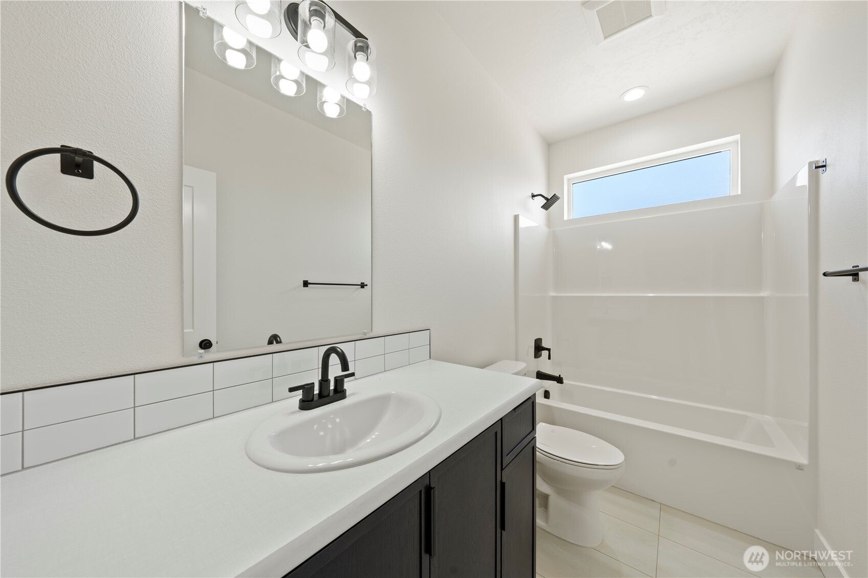 1111 E Mount Othello, WA 99344 - Photo 22 of 34 a bathroom with a sink a toilet and shower