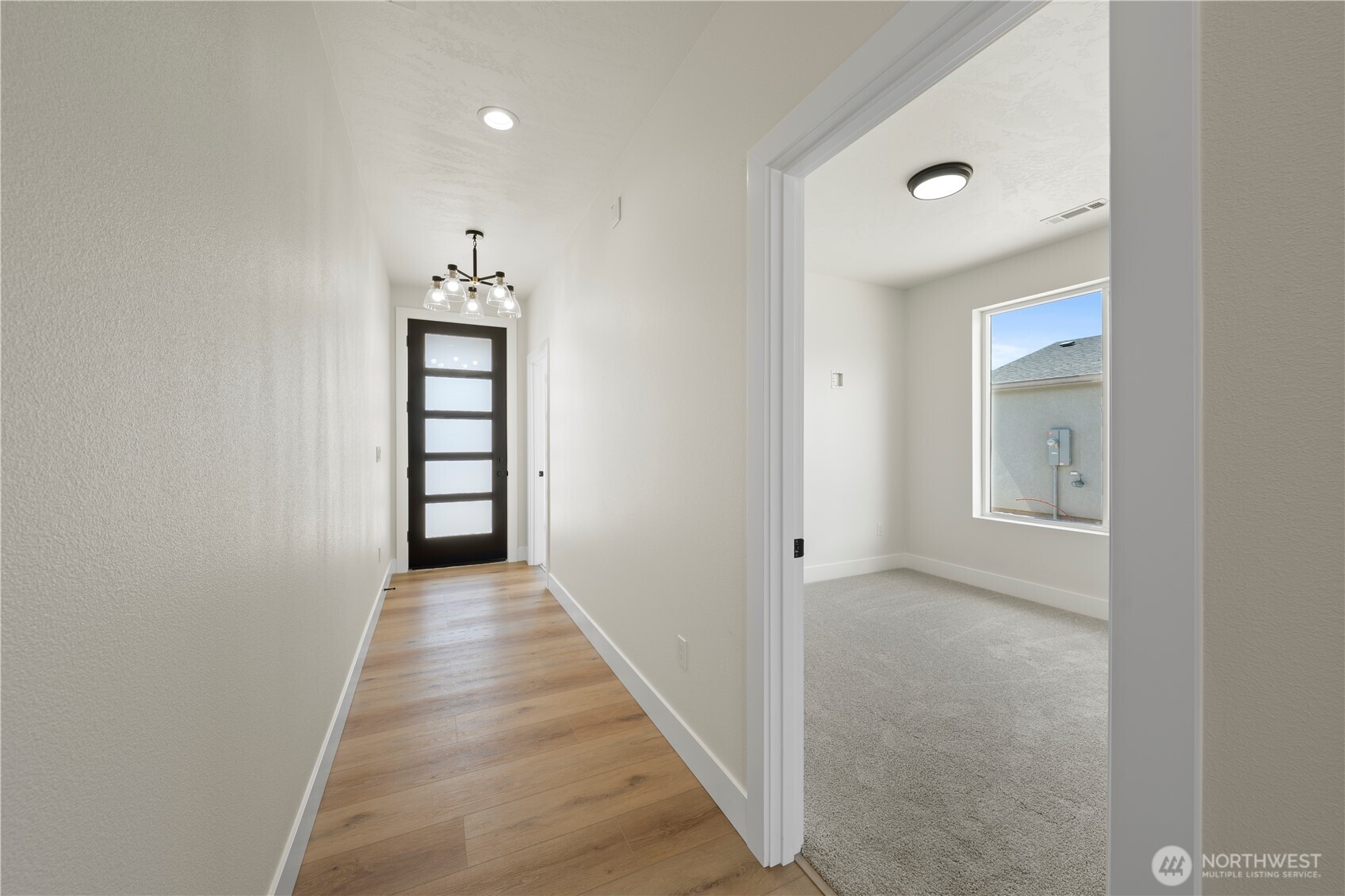 1111 E Mount Othello, WA 99344 - Photo 24 of 34 a view of a hallway with wooden floor and closet