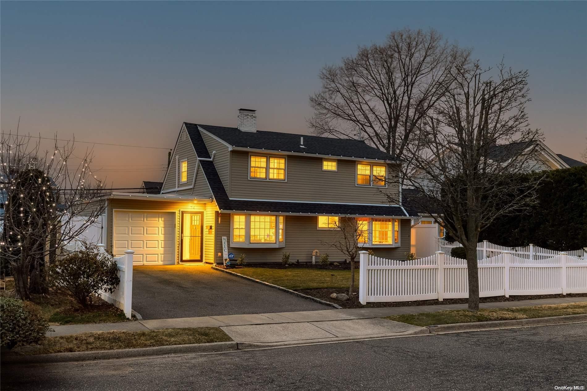 74 Flamingo Road Levittown, NY 11756 - Photo 1 of 1 a front view of a house with a yard