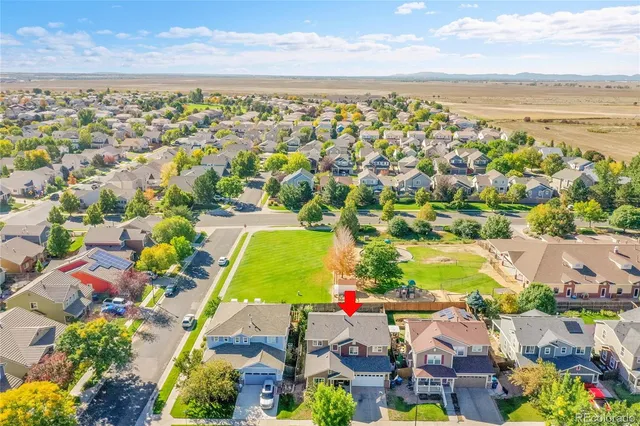 an aerial view of residential building and ocean