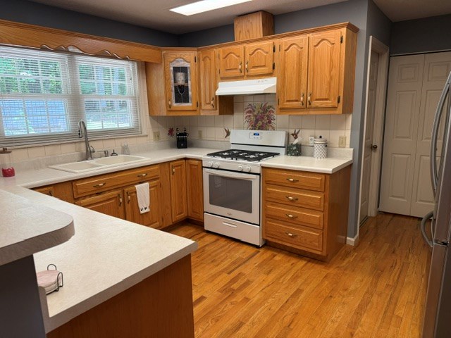 2948 Hendriske Road Young Harris, GA 30582 - Photo 7 of 20 a kitchen with a stove a sink and a microwave