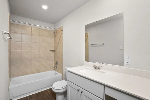 a bathroom with a sink a toilet and a bathtub