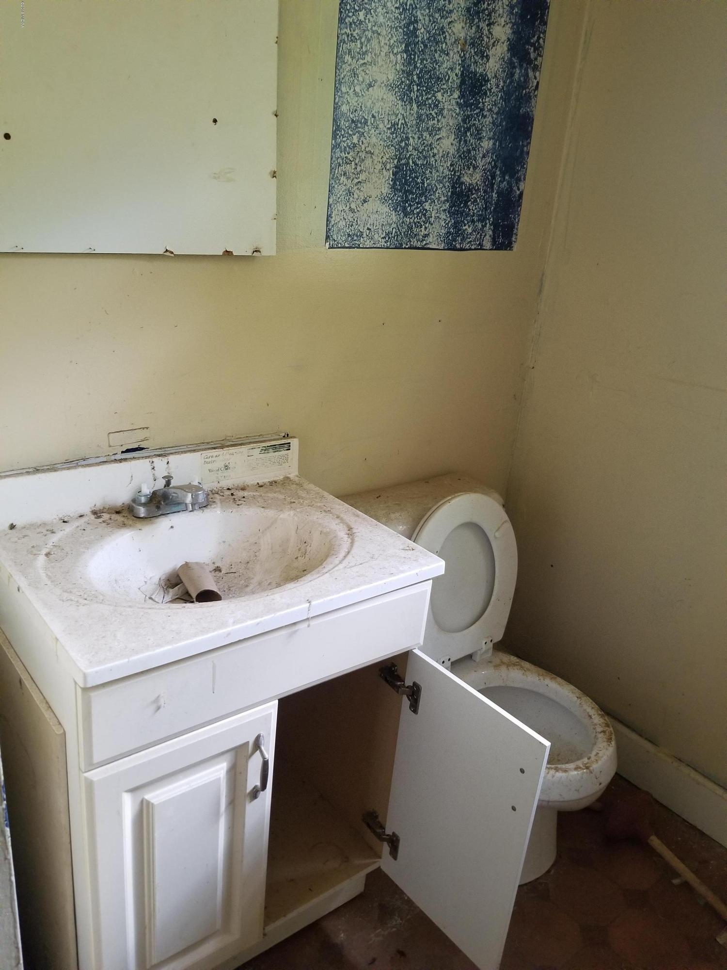 2315 Millerfield Road Macon, GA 31217 - Photo 8 of 8 a bathroom with a sink and a toilet
