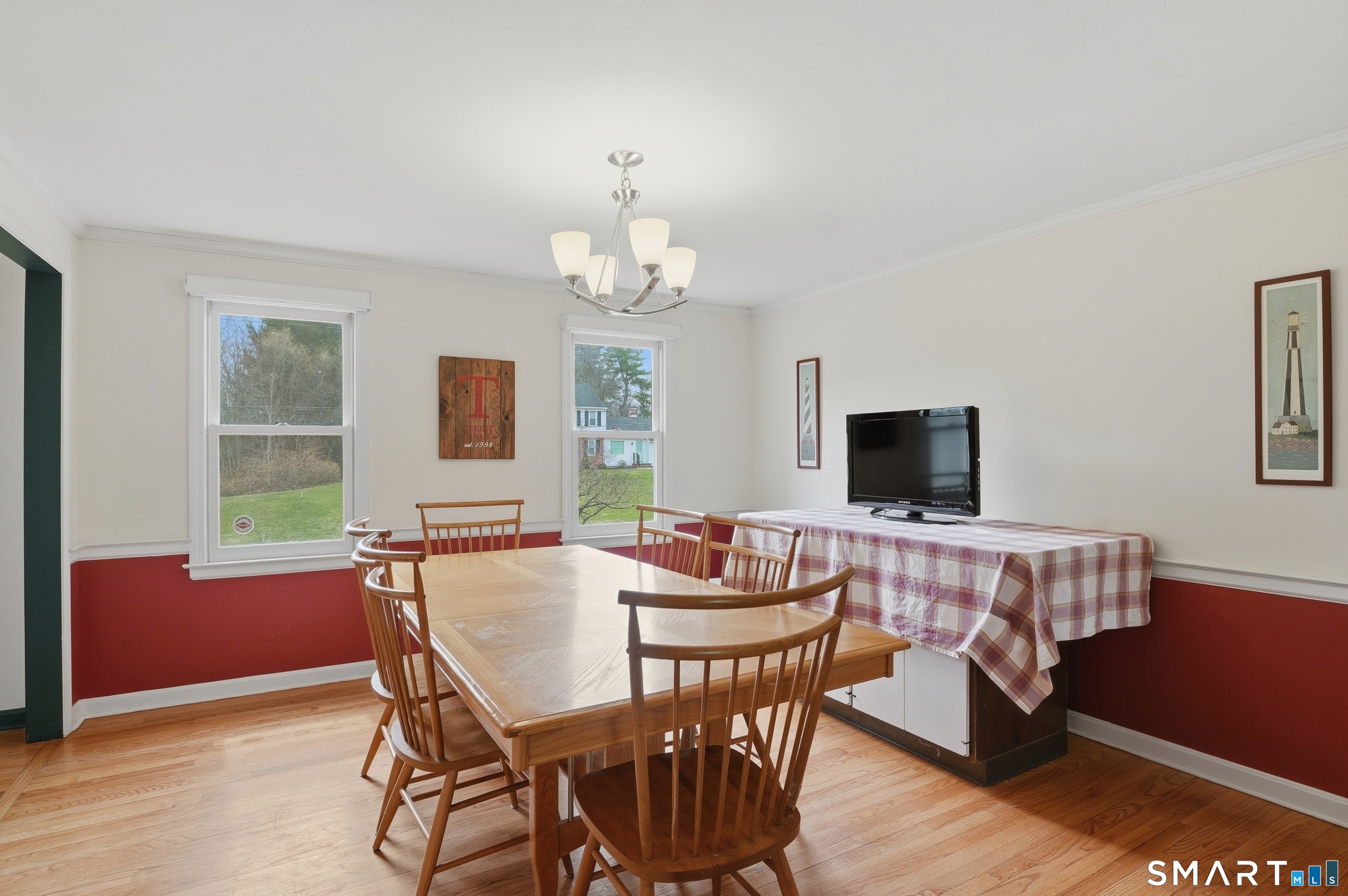 88 Nob Hill Road Cheshire, CT 06410 - Photo 11 of 40 a view of a dining room with furniture window and wooden floor