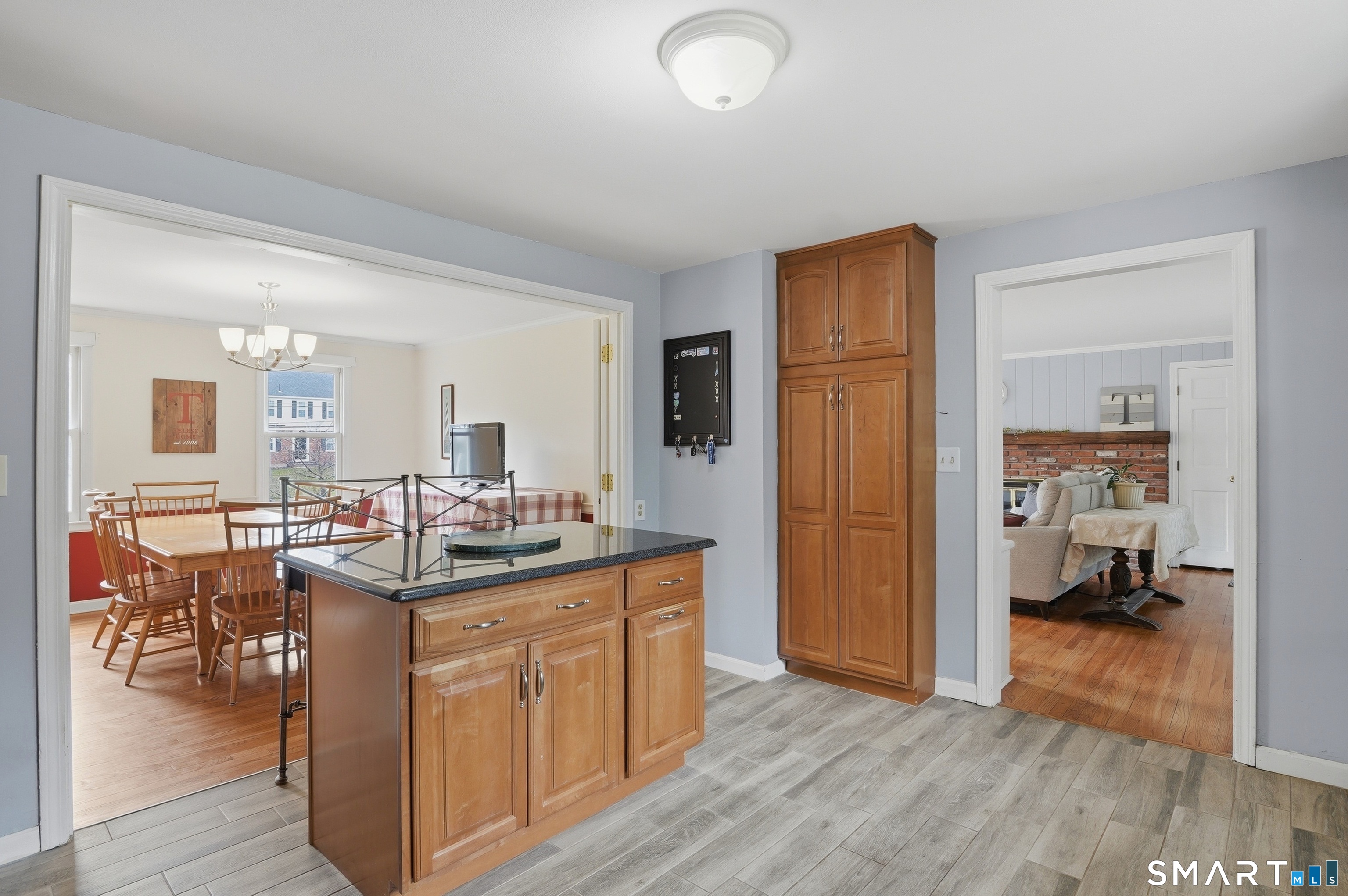 88 Nob Hill Road Cheshire, CT 06410 - Photo 16 of 40 a kitchen with a sink and a refrigerator