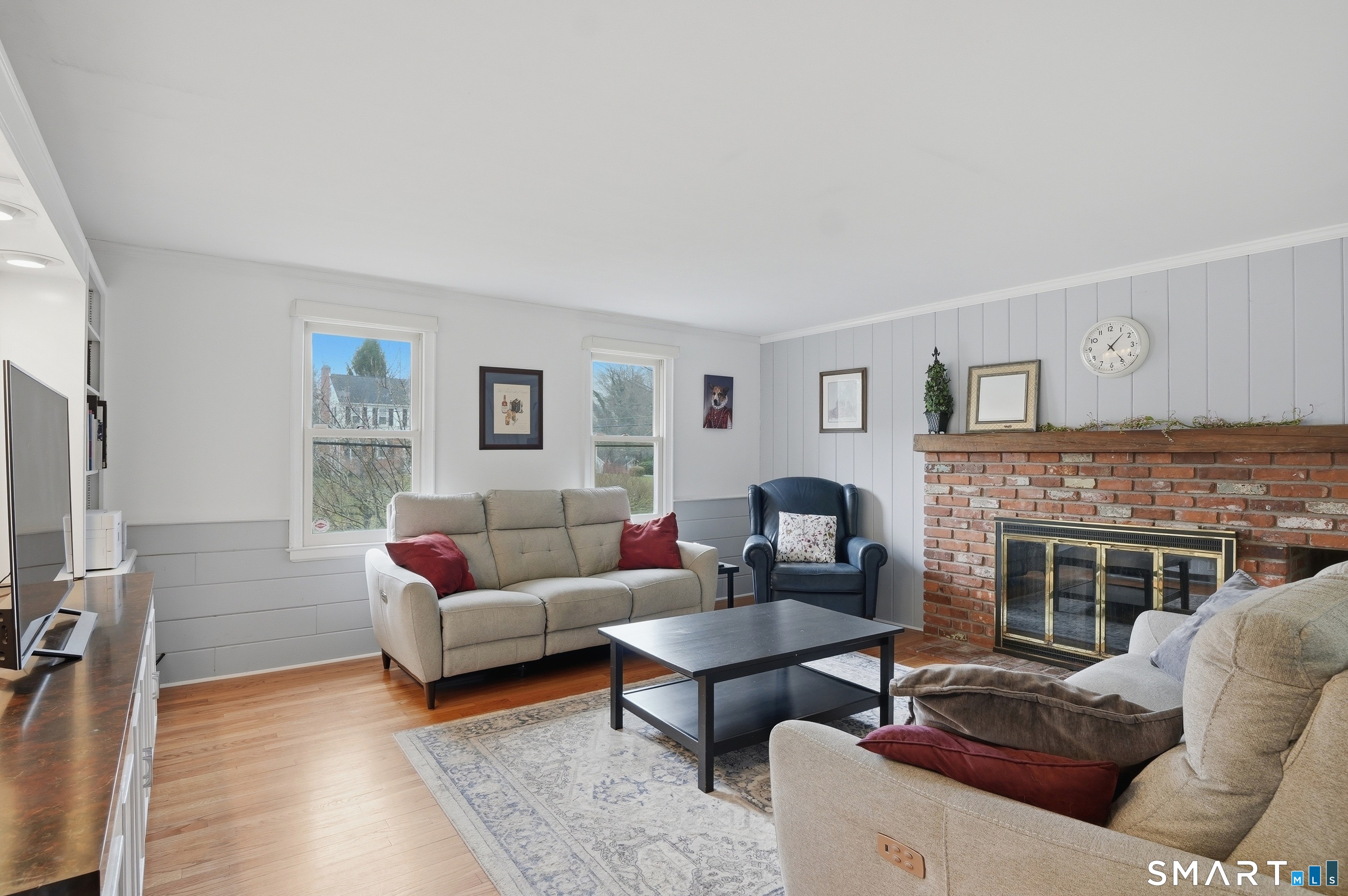 88 Nob Hill Road Cheshire, CT 06410 - Photo 17 of 40 a living room with furniture and a fireplace