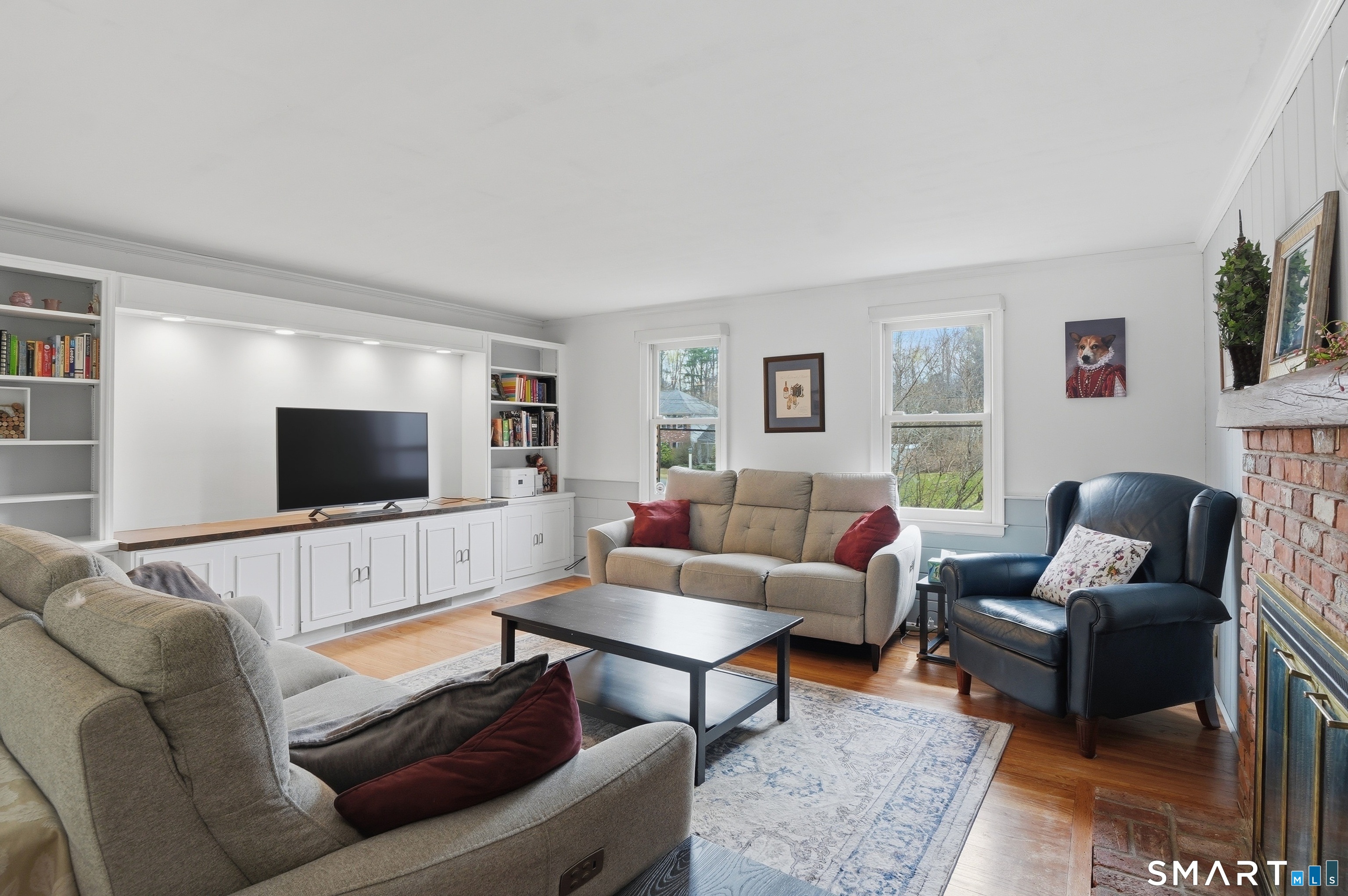 88 Nob Hill Road Cheshire, CT 06410 - Photo 19 of 40 a living room with furniture and a flat screen tv