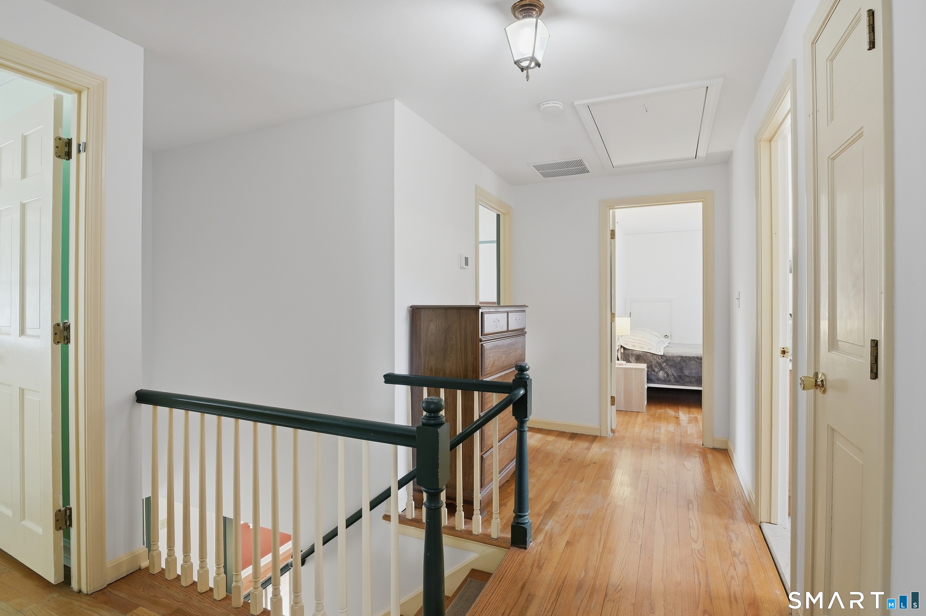 88 Nob Hill Road Cheshire, CT 06410 - Photo 23 of 40 a view of a hallway with wooden floor and staircase