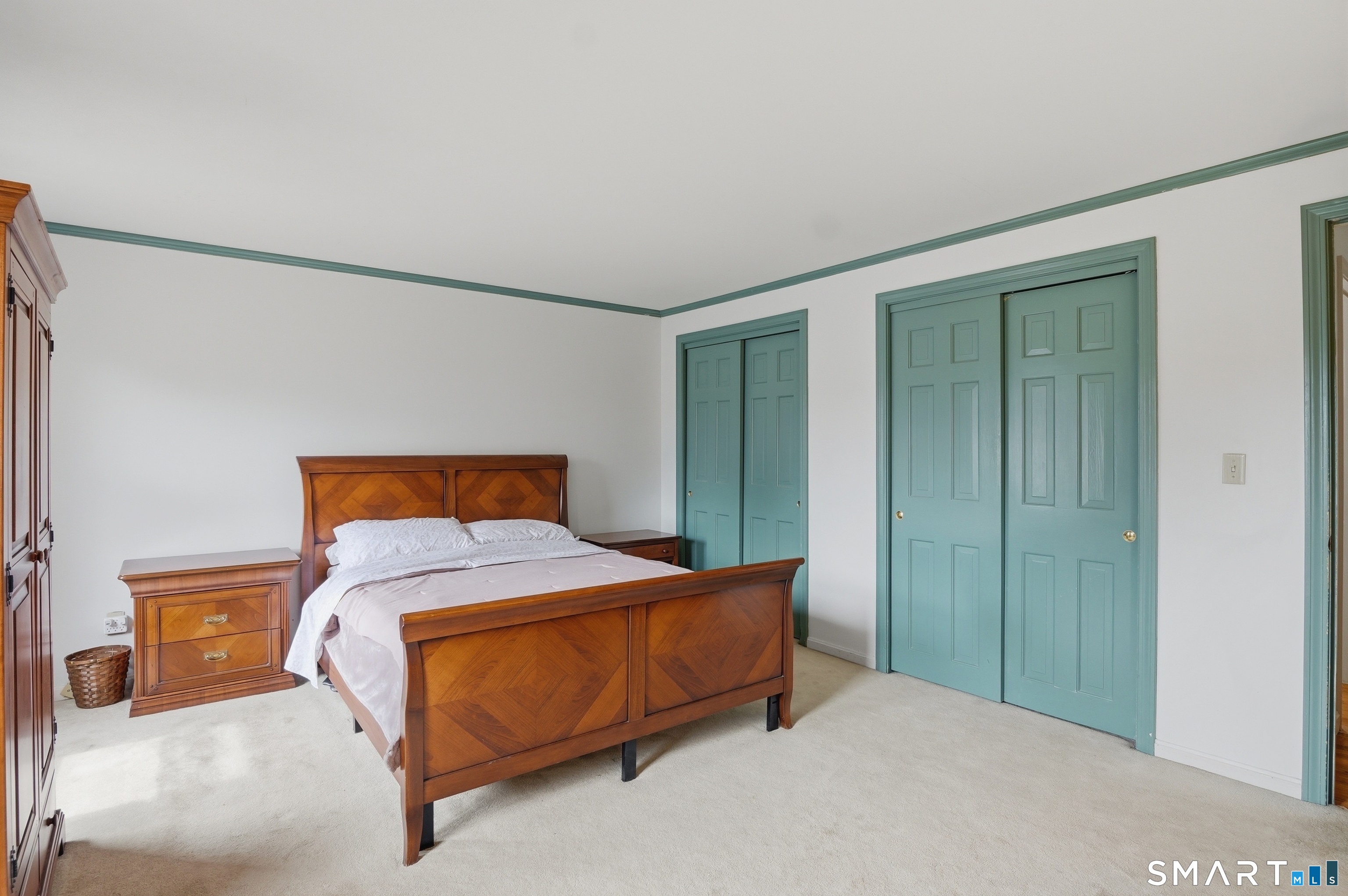 88 Nob Hill Road Cheshire, CT 06410 - Photo 25 of 40 a bedroom with a bed and a cabinets