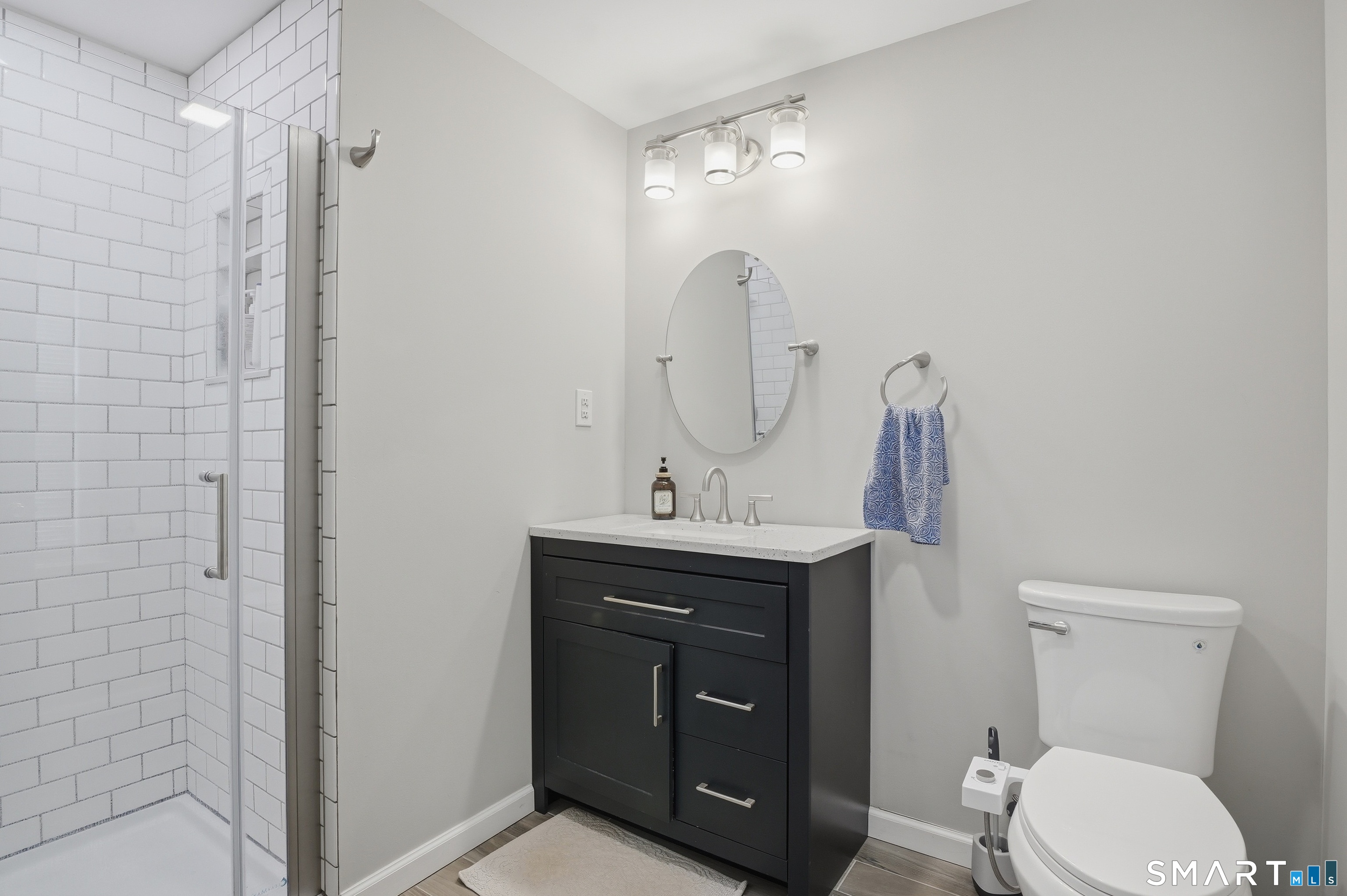 88 Nob Hill Road Cheshire, CT 06410 - Photo 27 of 40 a bathroom with a toilet a sink and mirror