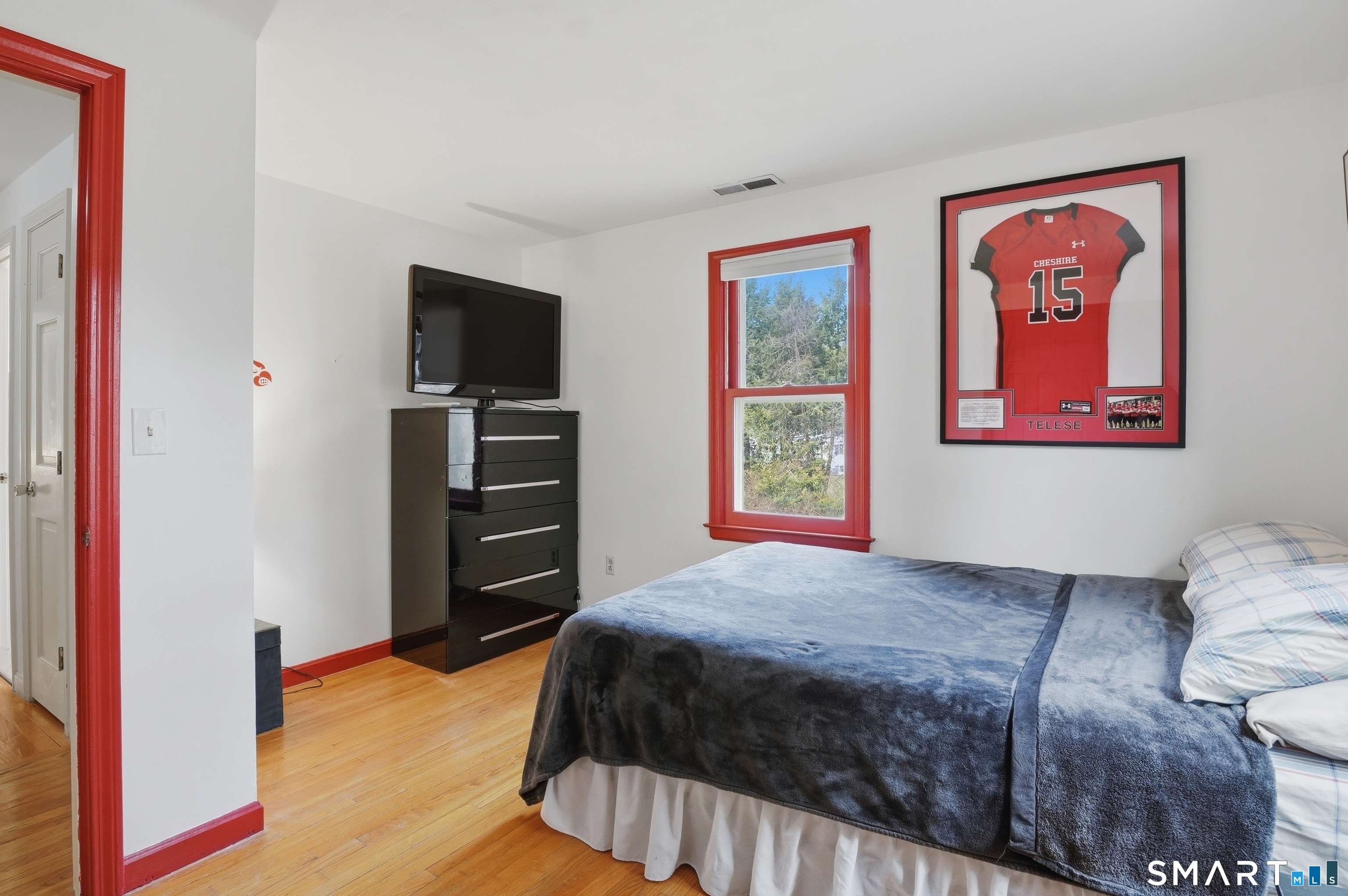 88 Nob Hill Road Cheshire, CT 06410 - Photo 33 of 40 a bedroom with a bed and a flat screen tv