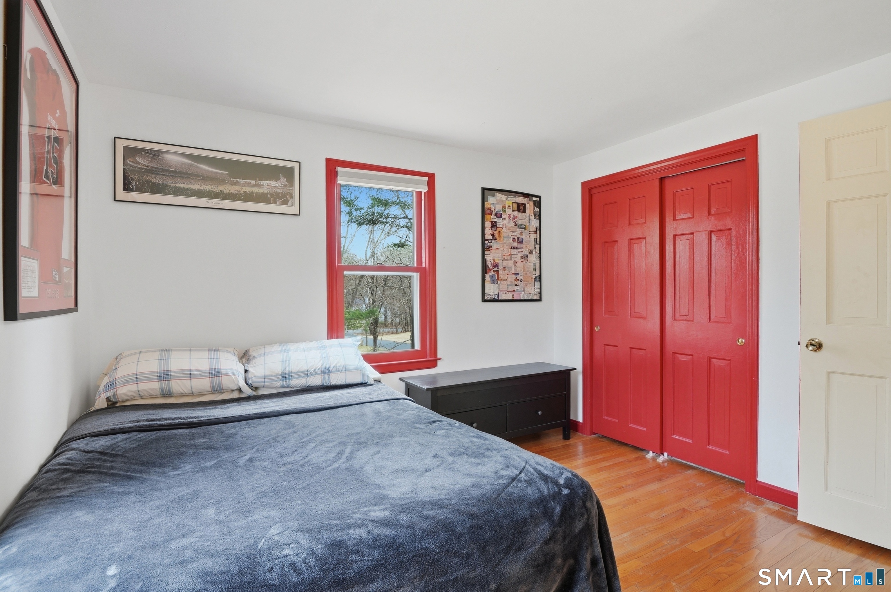 88 Nob Hill Road Cheshire, CT 06410 - Photo 34 of 40 a bedroom with a bed and wooden floor