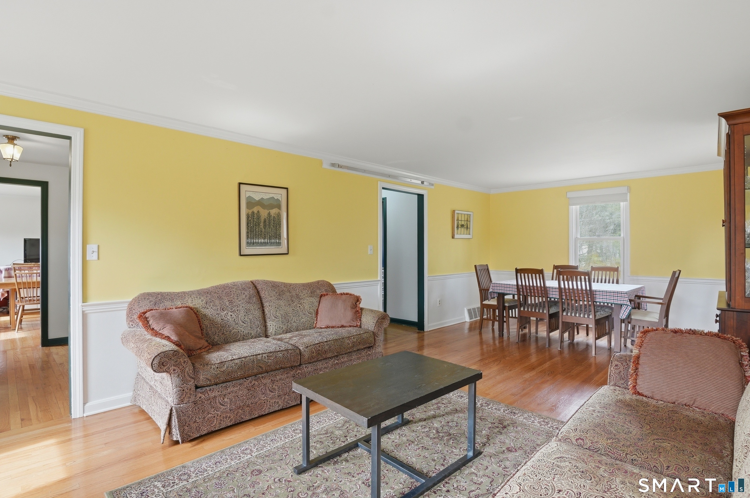 88 Nob Hill Road Cheshire, CT 06410 - Photo 5 of 40 a living room with furniture a dining table and a potted plant