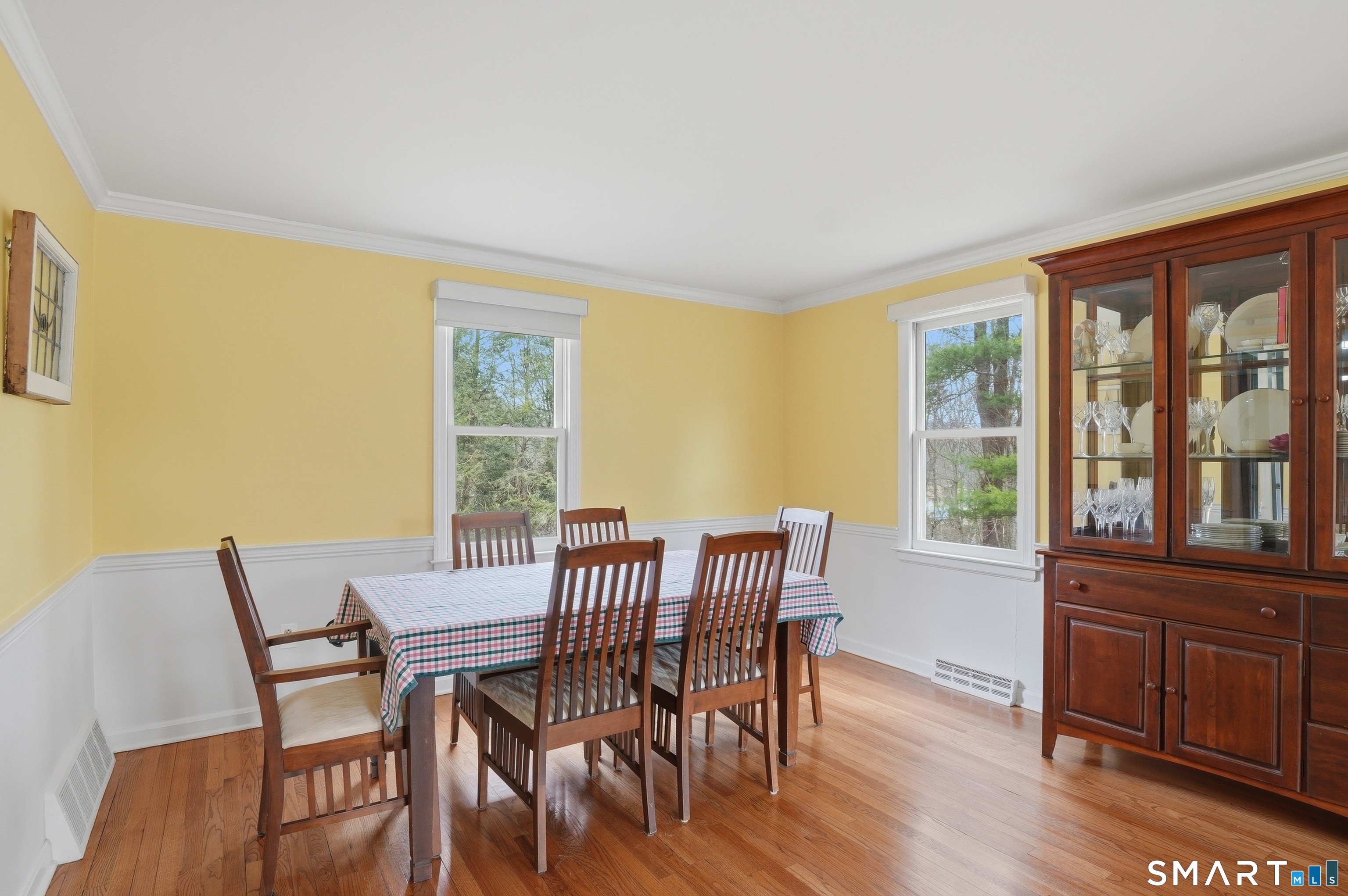 88 Nob Hill Road Cheshire, CT 06410 - Photo 7 of 40 a view of a dining room with furniture and windows