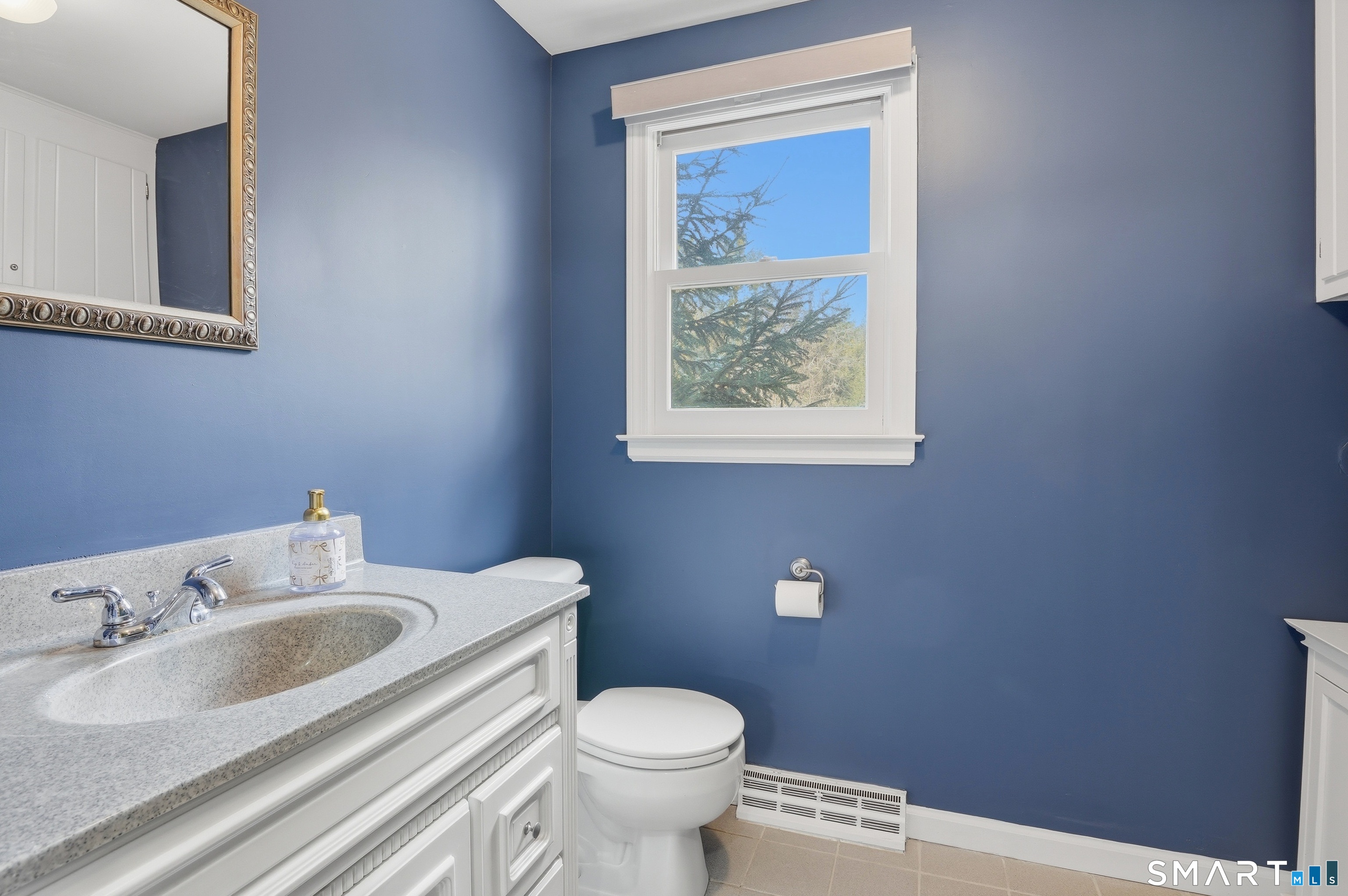 88 Nob Hill Road Cheshire, CT 06410 - Photo 9 of 40 a bathroom with a toilet sink and mirror