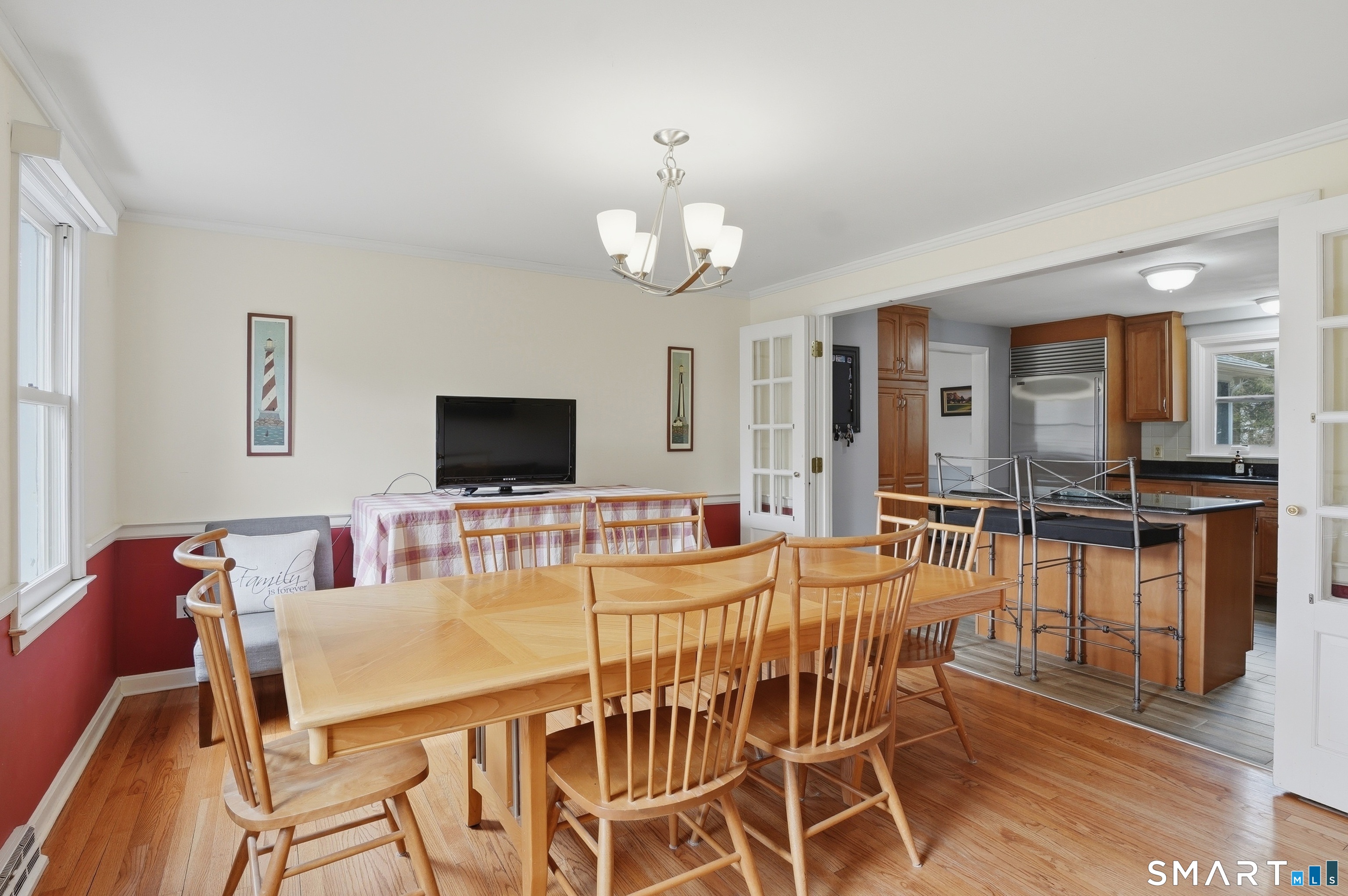 88 Nob Hill Road Cheshire, CT 06410 - Photo 10 of 40 a view of a dining room with furniture and wooden floor