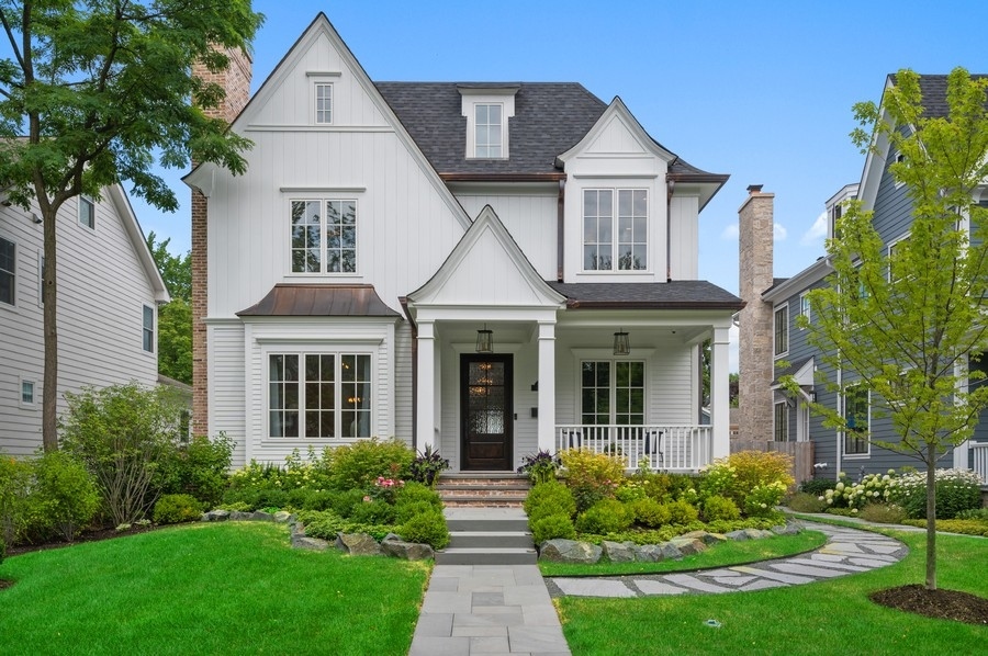 1025 Oak Street Winnetka, IL 60093 - Photo 1 of 38 a front view of a house with garden