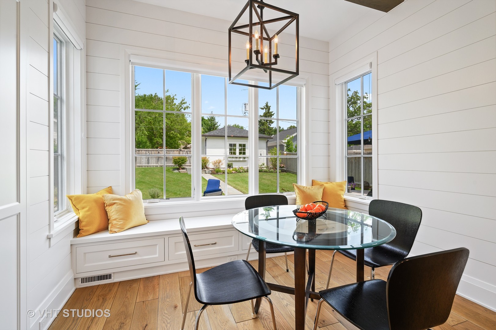 1025 Oak Street Winnetka, IL 60093 - Photo 11 of 38 a dining room with furniture a chandelier and wooden floor