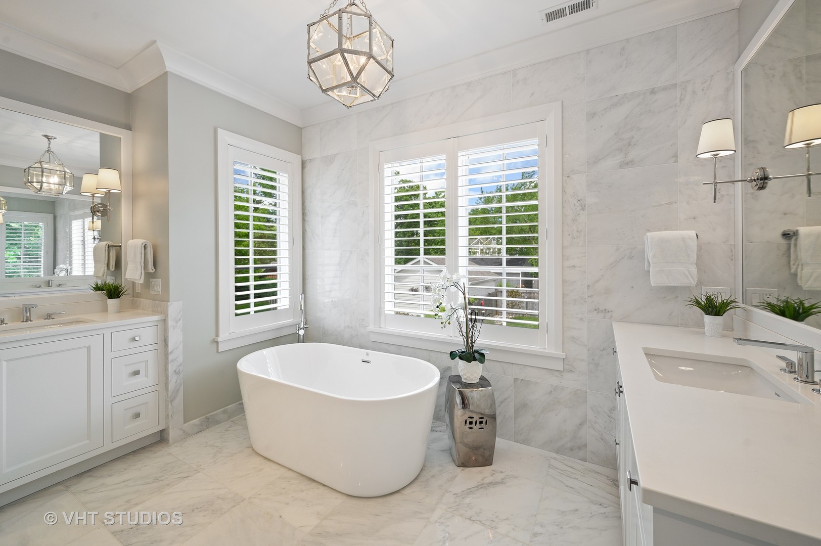 1025 Oak Street Winnetka, IL 60093 - Photo 17 of 38 a bathroom with a bathtub a sink and a window