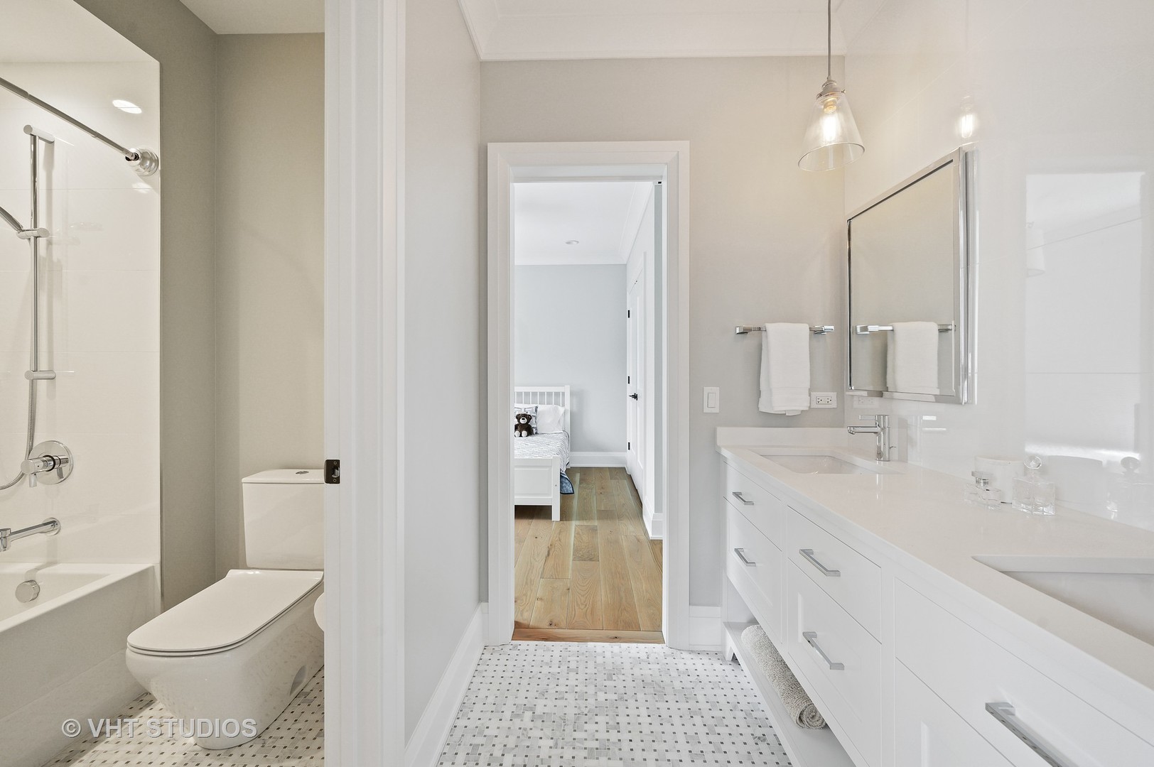 1025 Oak Street Winnetka, IL 60093 - Photo 19 of 38 a bathroom with a sink a toilet and shower