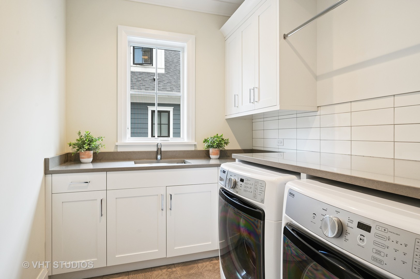 1025 Oak Street Winnetka, IL 60093 - Photo 22 of 38 a kitchen with granite countertop white cabinets stainless steel appliances and sink