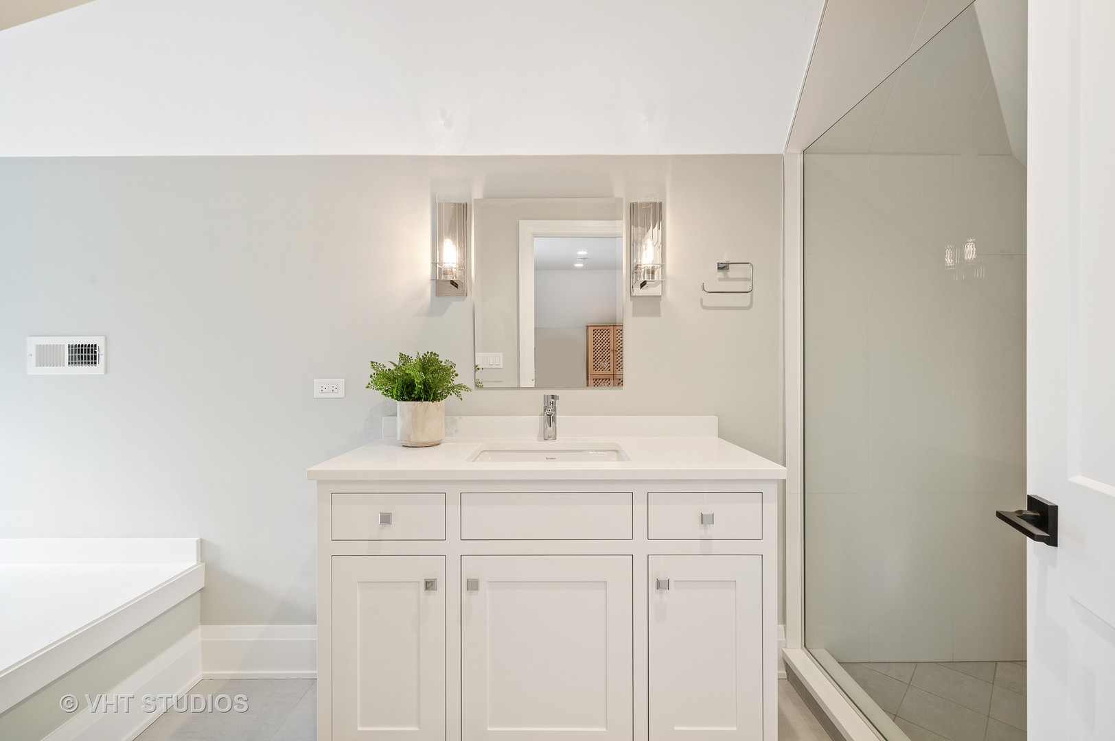 1025 Oak Street Winnetka, IL 60093 - Photo 24 of 38 a bathroom with a sink and a mirror