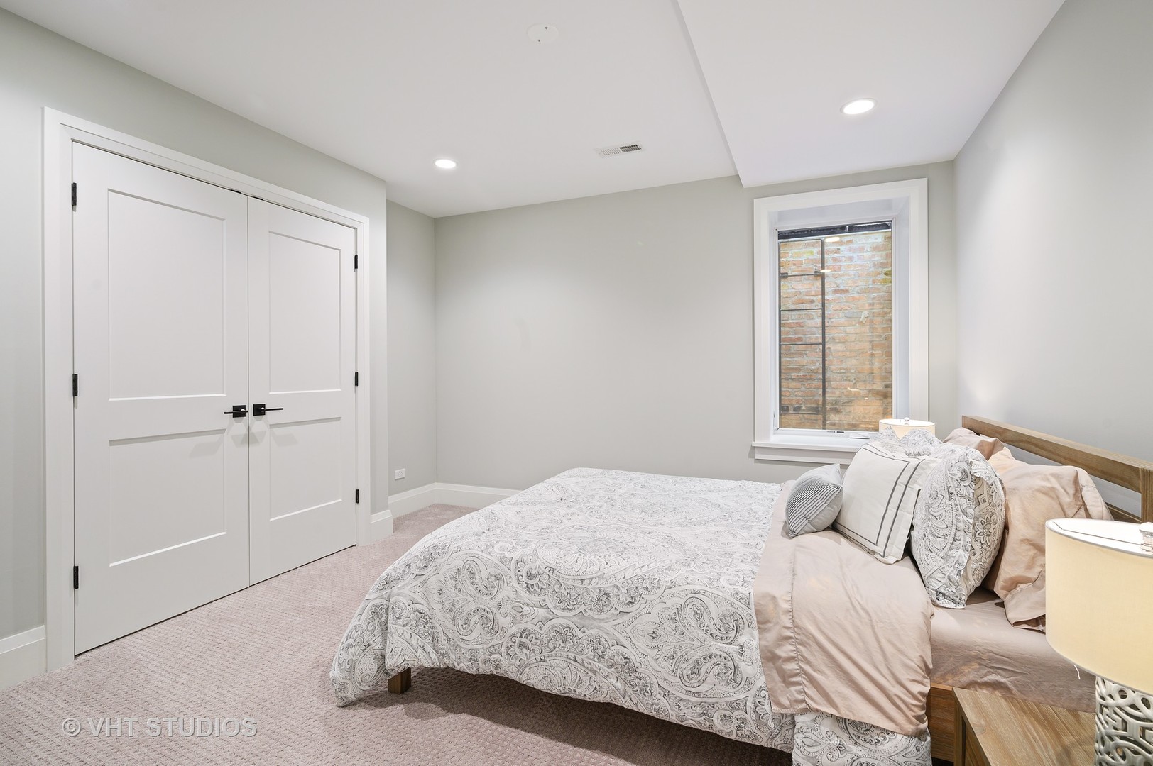 1025 Oak Street Winnetka, IL 60093 - Photo 30 of 38 a bedroom with a bed and a window