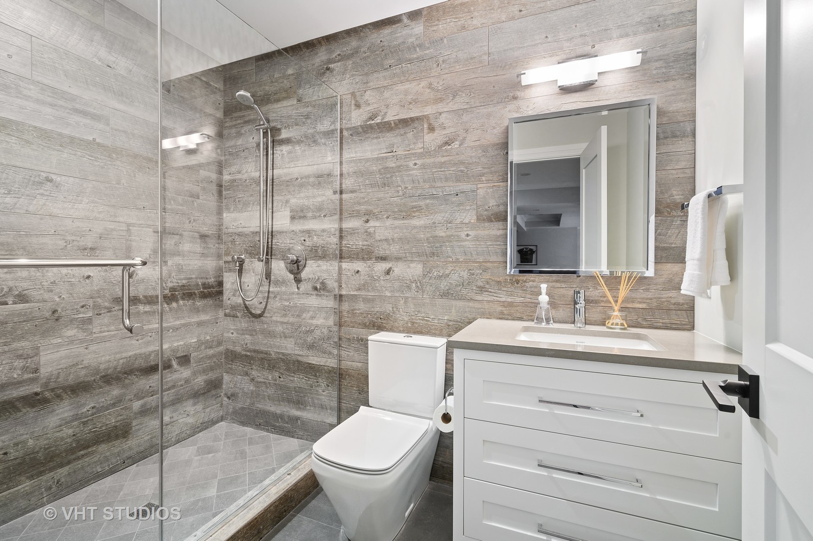 1025 Oak Street Winnetka, IL 60093 - Photo 31 of 38 a bathroom with a sink a toilet and shower