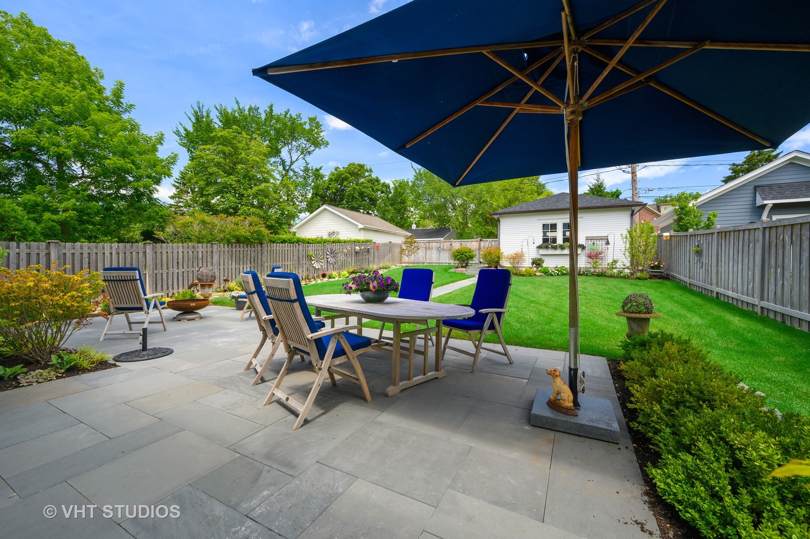 1025 Oak Street Winnetka, IL 60093 - Photo 32 of 38 a view of a table and chairs under an umbrella