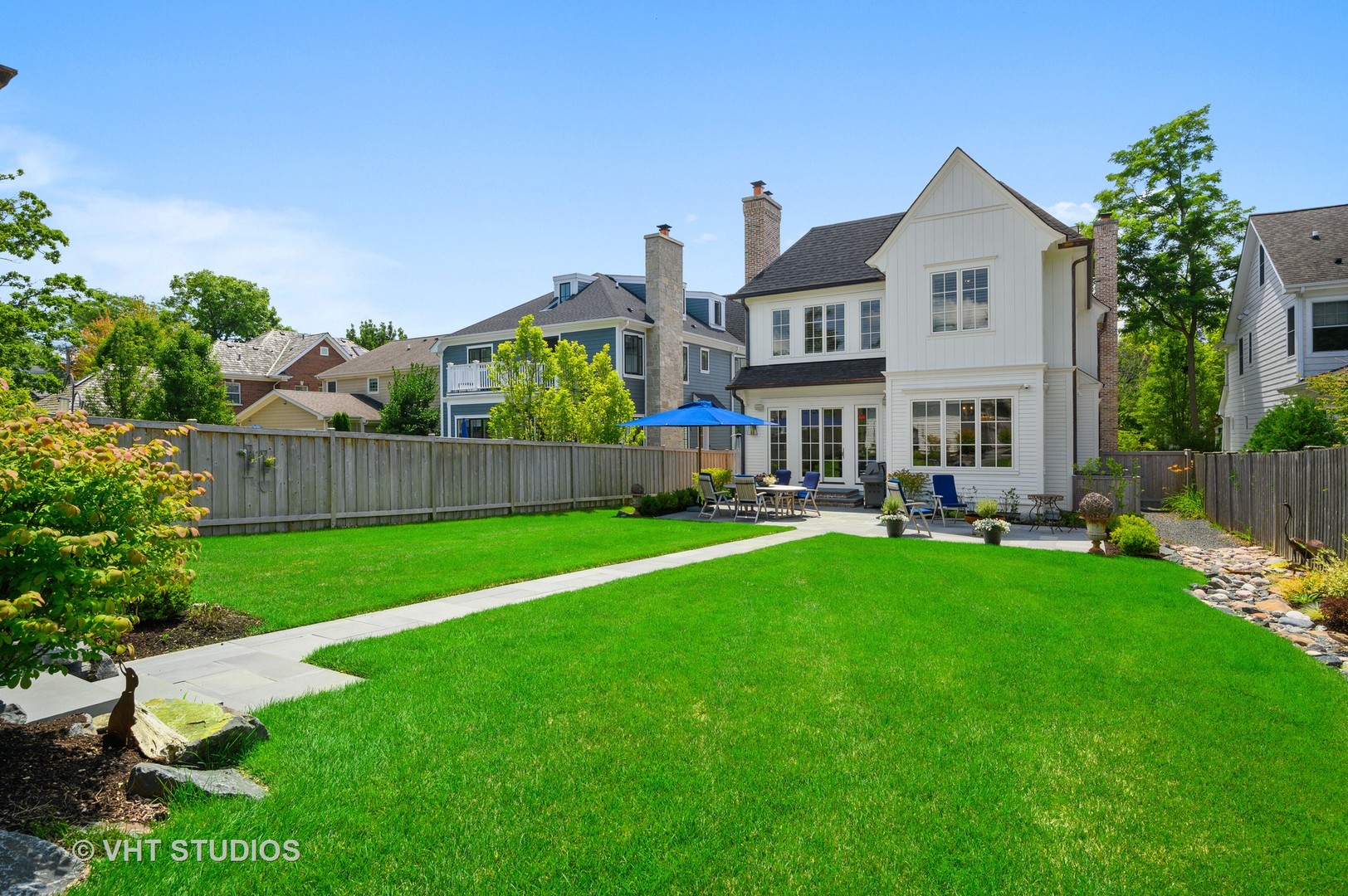 1025 Oak Street Winnetka, IL 60093 - Photo 33 of 38 a view of an house with backyard and a garden