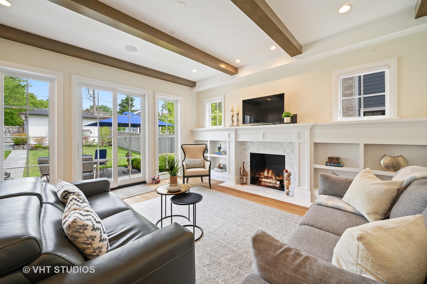 1025 Oak Street Winnetka, IL 60093 - Photo 5 of 38 a living room with furniture fireplace and flat screen tv