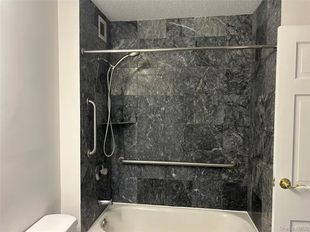 a view of swimming pool with a patio