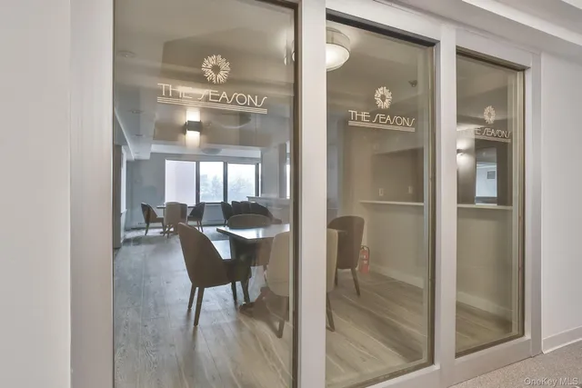 a view of a room with air conditioner and windows