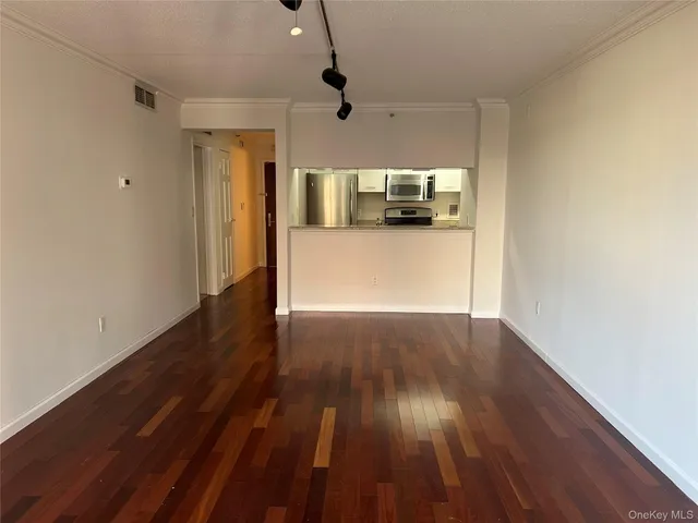 a kitchen with stainless steel appliances a refrigerator and a counter top space