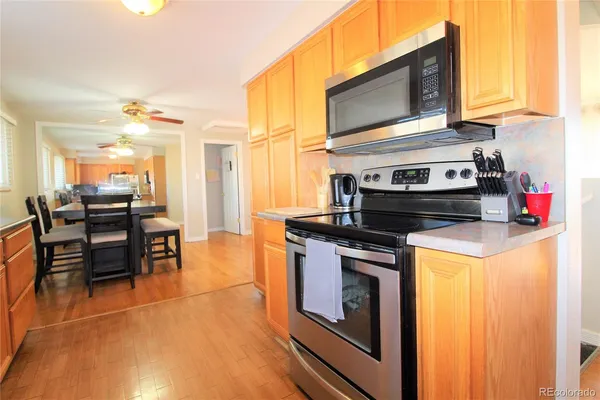 a kitchen with stainless steel appliances granite countertop a stove and a refrigerator