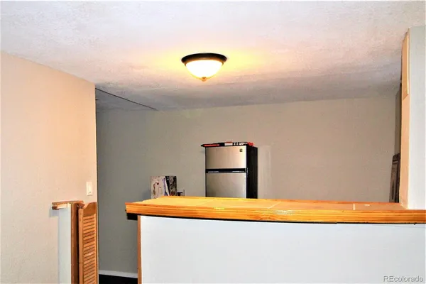 a bed room with a bed and a night stand
