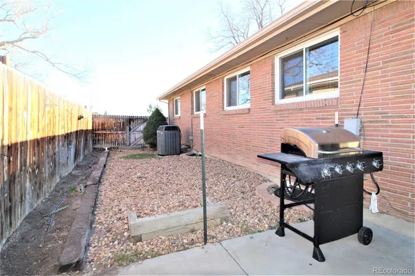 a view of a backyard with sitting area