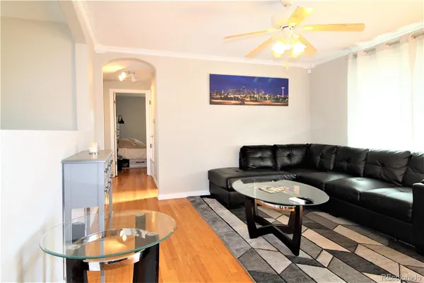 a living room with furniture and a table