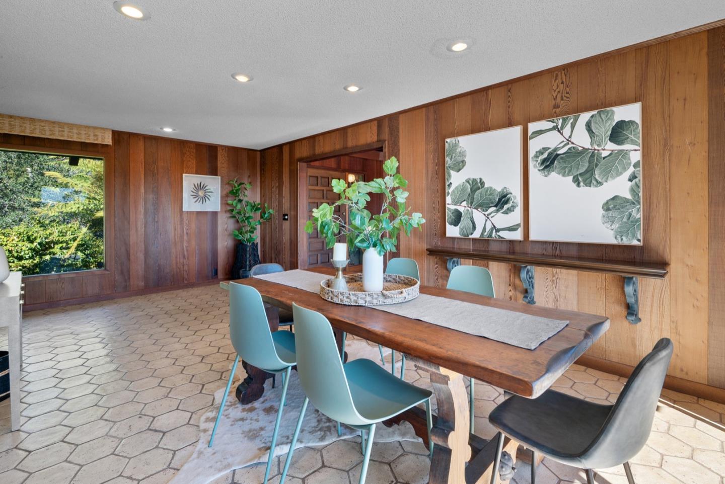 390 Rancho Soquel Drive Soquel, CA 95073 - Photo 17 of 97 a dining room with furniture a potted plant and a large window