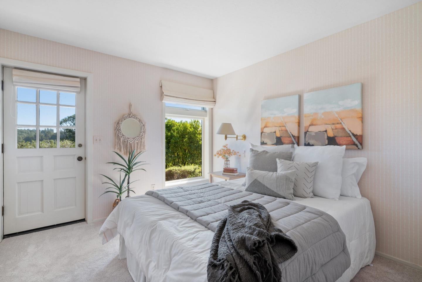 390 Rancho Soquel Drive Soquel, CA 95073 - Photo 52 of 97 a bedroom with a large bed and a large window