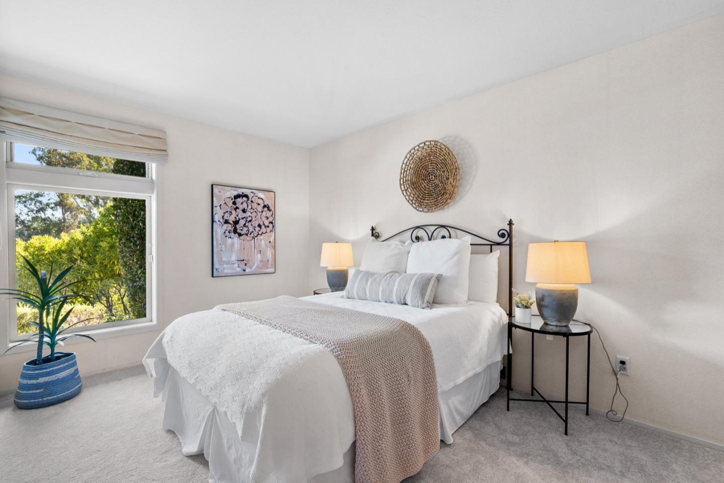 390 Rancho Soquel Drive Soquel, CA 95073 - Photo 67 of 97 a bedroom with a bed and a potted plant