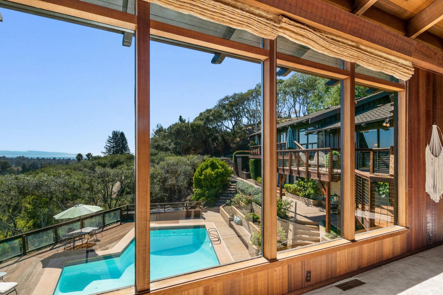 390 Rancho Soquel Drive Soquel, CA 95073 - Photo 7 of 97 a view of a balcony with floor to ceiling windows and wooden floor