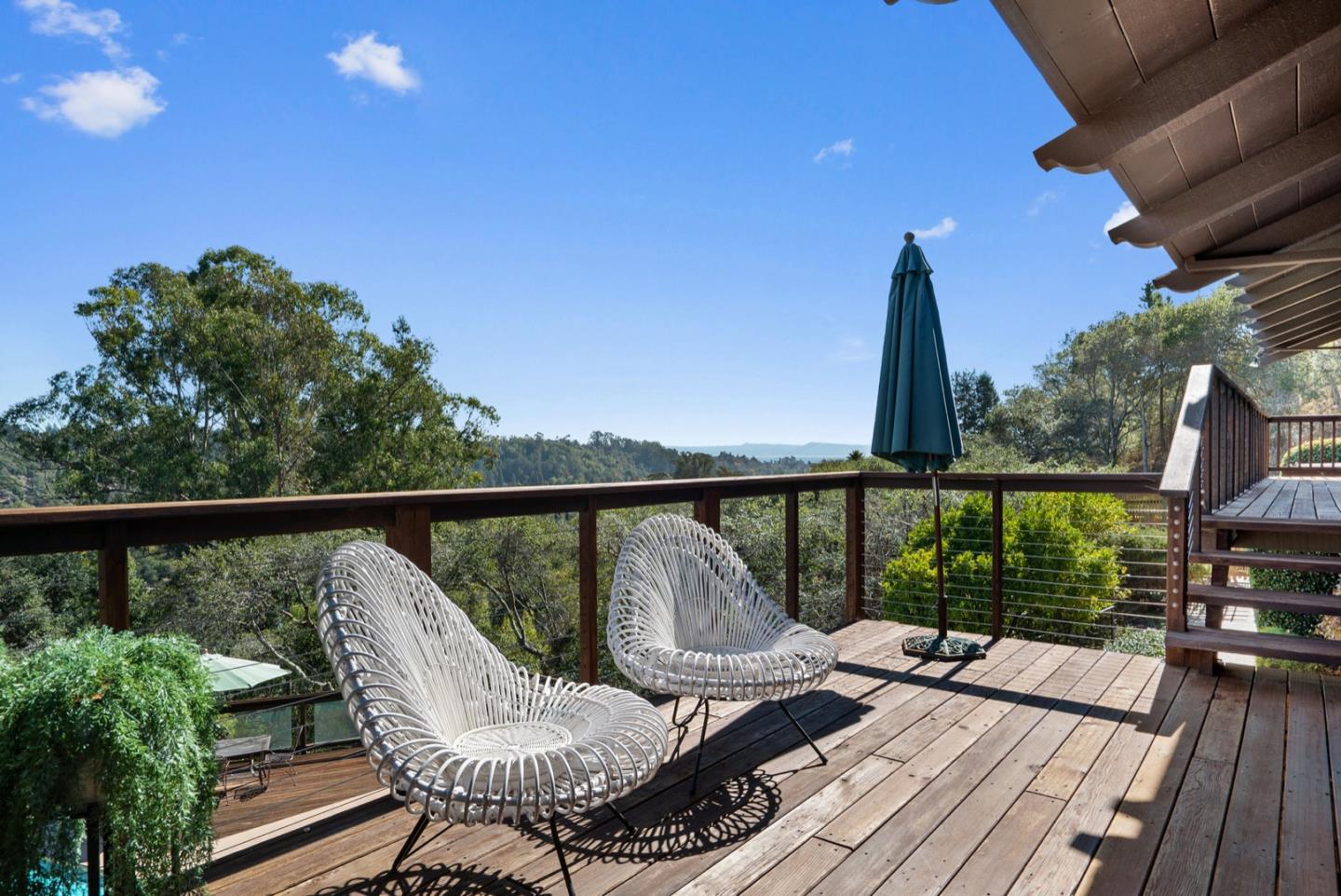390 Rancho Soquel Drive Soquel, CA 95073 - Photo 89 of 97 a view of a balcony with wooden floor and outdoor seating