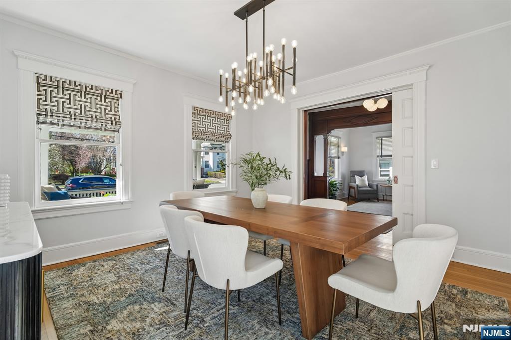115 Park Street Montclair, NJ 07042 - Photo 18 of 45 a view of a dining room with furniture a chandelier and wooden floor