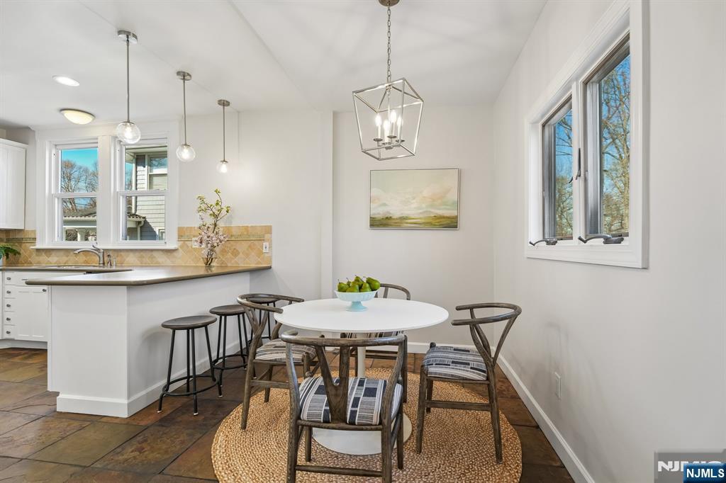 115 Park Street Montclair, NJ 07042 - Photo 23 of 45 a view of a dining room with furniture a chandelier and wooden floor